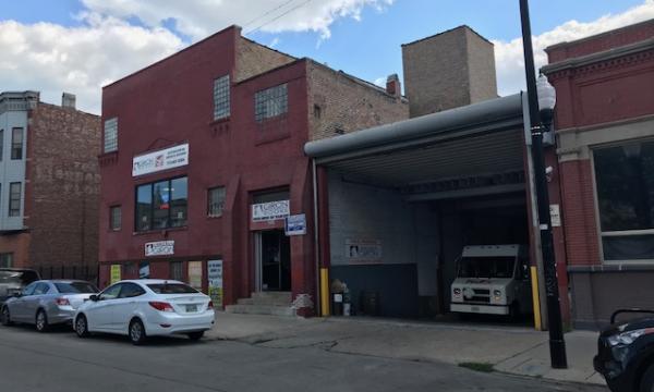 Three story flex industrial building with warehouse, retail and office space