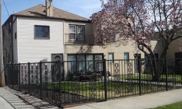 Two apartment building behind showroom