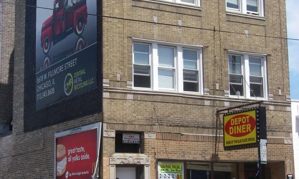 Three story building with apartments and retail space