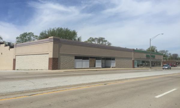 Vanilla box storefront adjacent to Dollar Tree for rent