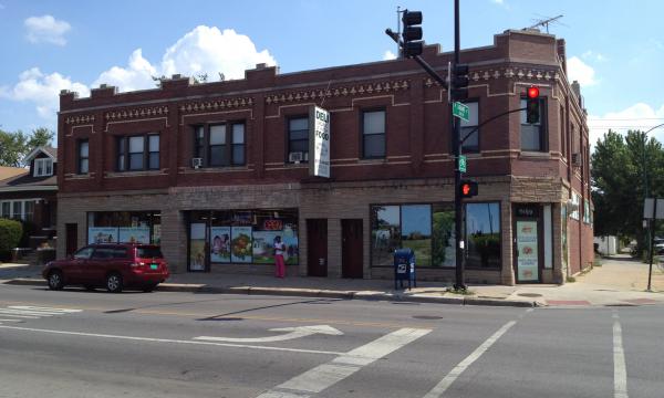 Corner mixed-use building with retail and apartments