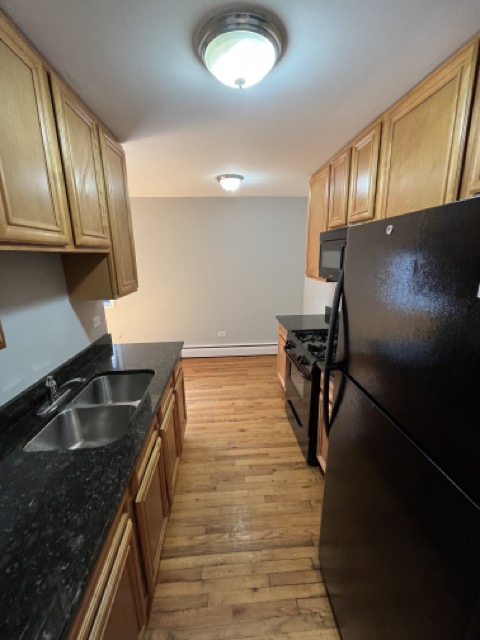 Auction – June 17, 2025 | Two Rogers Park Condominiums